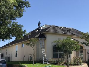 Roofing work underway by Alpha Roofing team
