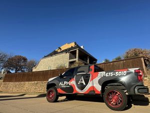 Skilled roofers working on residential project