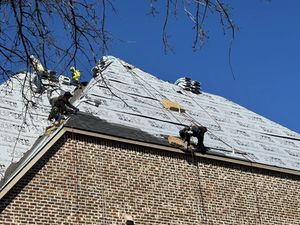 Professional roofing work in progress in DFW