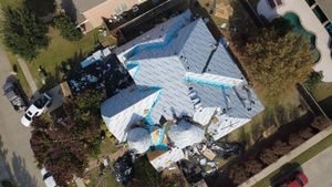 Overhead view of roofing project progress in DFW